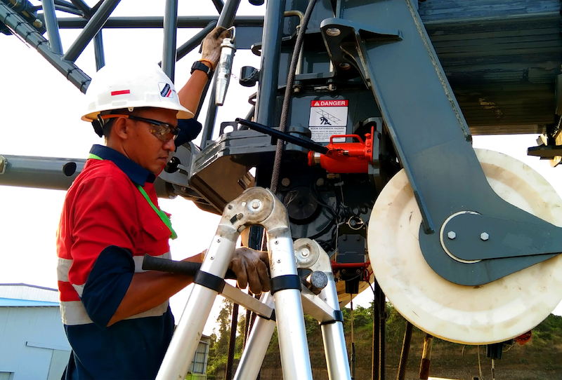A technician inspect a crane